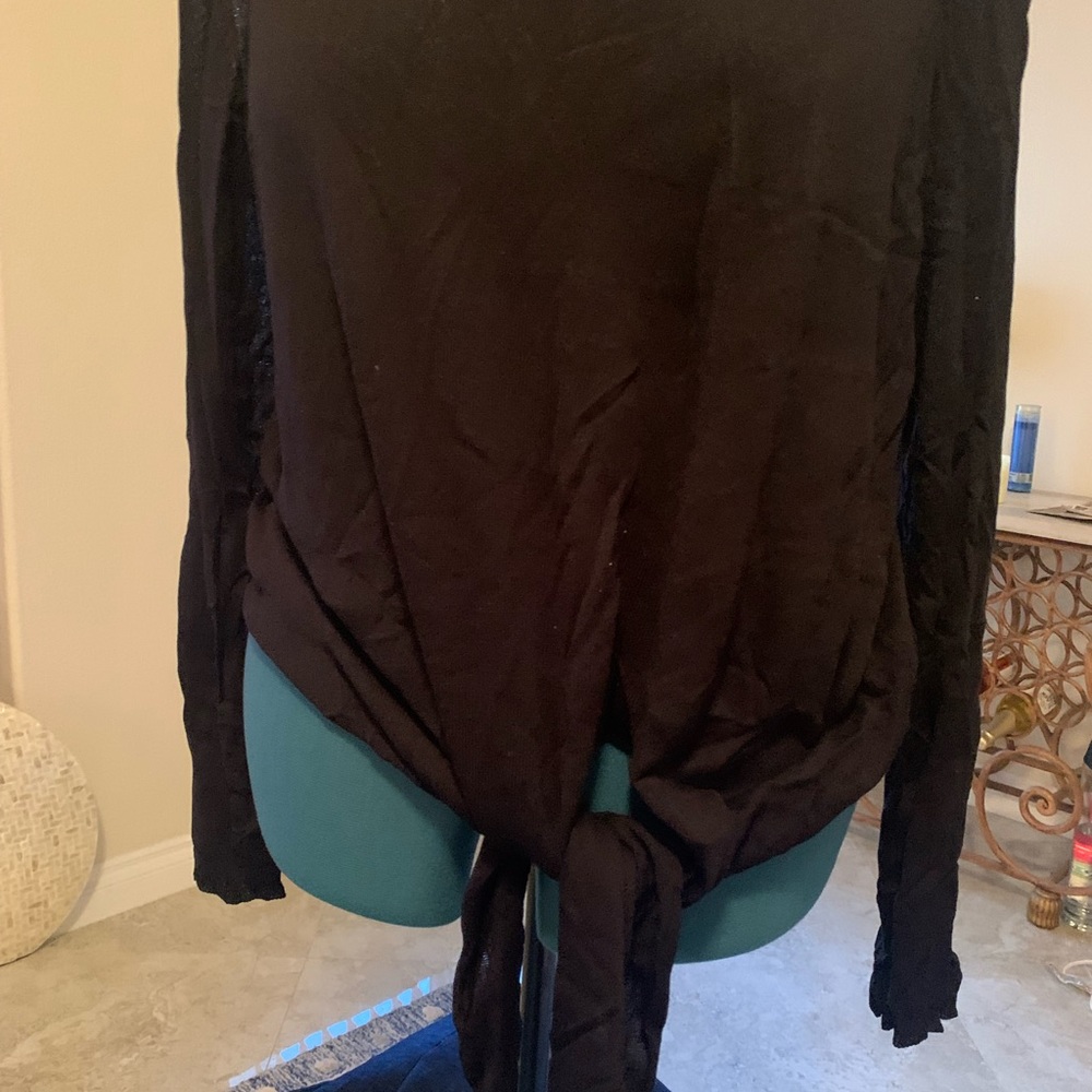 Lightweight black sweater with tie bottom